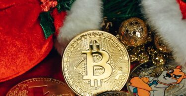 Bitcoin and other cryptocurrency coins amidst festive holiday decorations